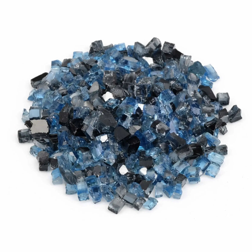 Overhead view of Maui Breeze pre-mix 1/2 inch reflective tempered fire glass arranged in a circular mound, highlighting the balanced mix of navy, steel gray, and icy blue tones.