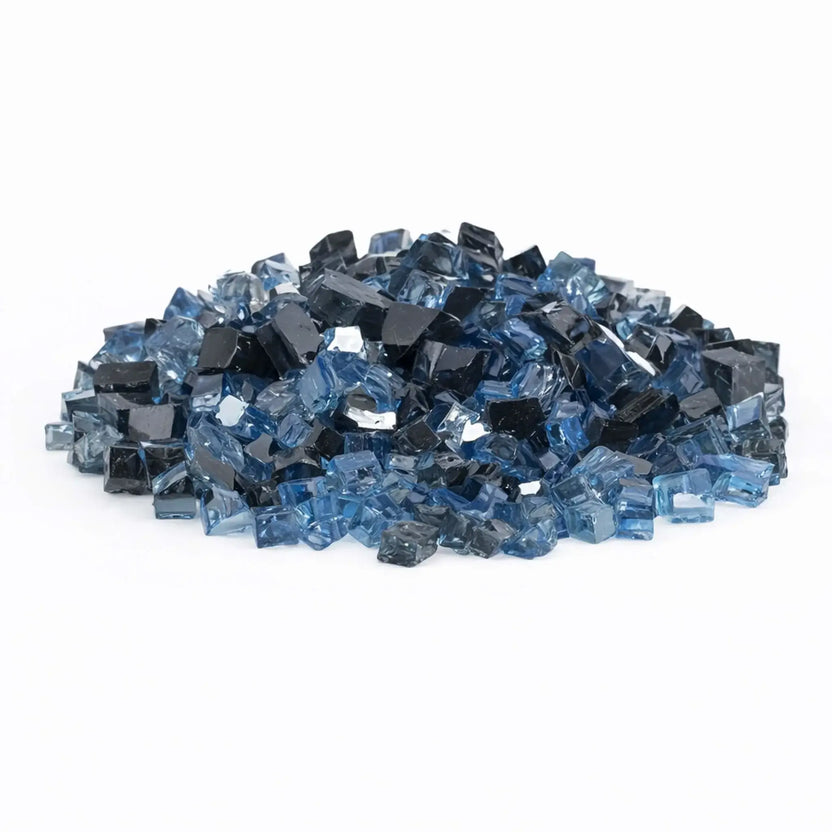 Pile of American Fire Products 1/2 inch reflective tempered fire glass in the Maui Breeze pre-mix, blending deep navy, smoky charcoal, and translucent sky blue pieces with a glossy, mirror-like finish.