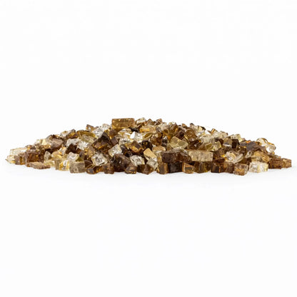 Low-profile mound of Zion pre-mix 1/2 inch reflective tempered fire glass combining rich bronze brown, warm honey gold, and clear pieces for a layered, high-contrast fire pit media look.