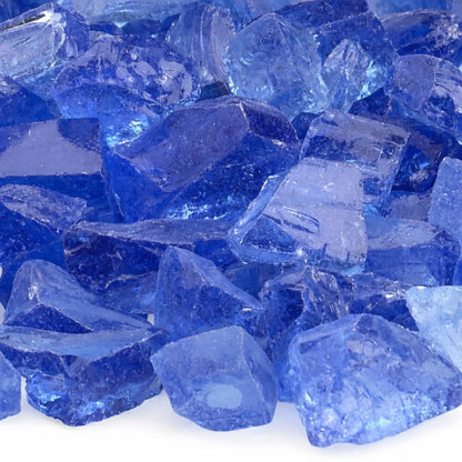 Close-up of light blue fire glass pieces displaying smooth, tempered edges and layered shades of pale blue with subtle sparkle and transparency.
