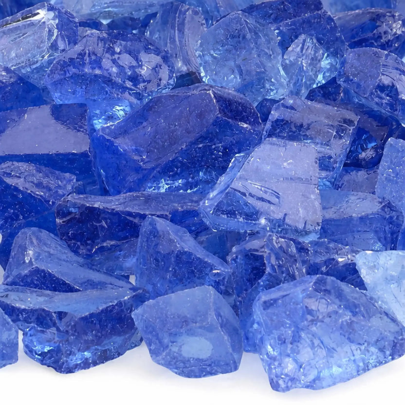 Close-up of light blue fire glass pieces displaying smooth, tempered edges and layered shades of pale blue with subtle sparkle and transparency.