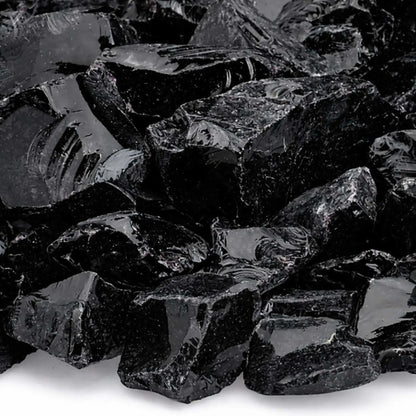 Close-up of Onyx Black fire glass highlighting smooth, tempered edges, mirror-like shine, and subtle texture variations across the dark, angular pieces.