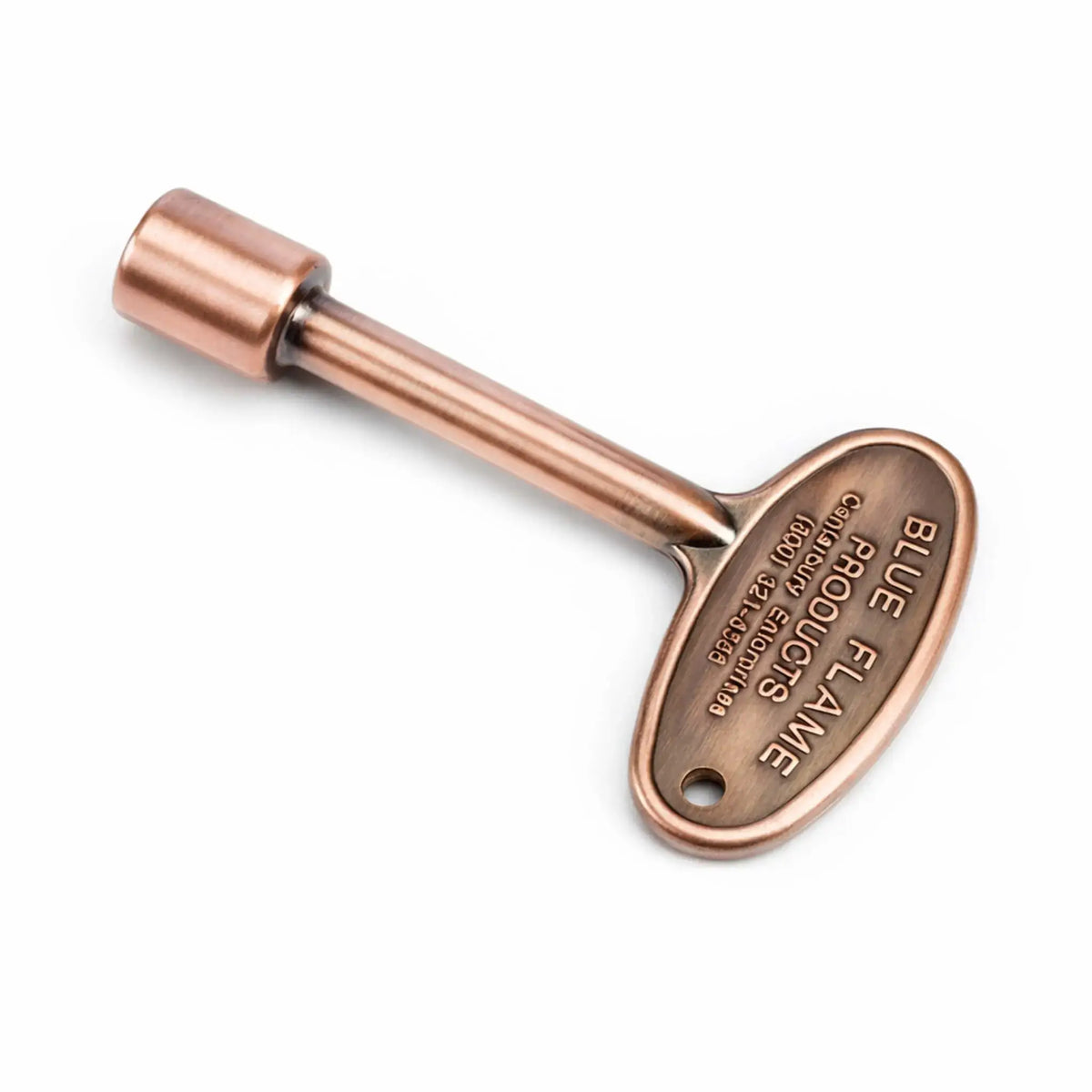 Antique copper gas valve key with oval handle, engraved branding details, and a smooth cylindrical shaft, designed for operating fire pit key valves, shown on a white background.