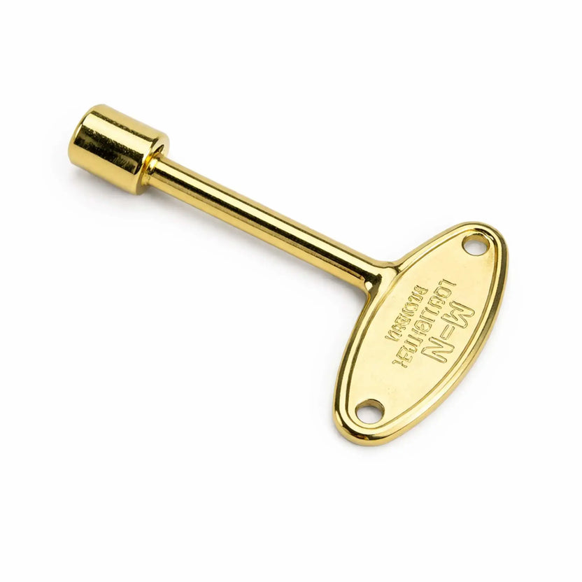 Polished brass fire pit key valve tool with engraved oval handle and smooth shaft, designed for turning gas valves, offering a bright gold finish for decorative fire pit installations.