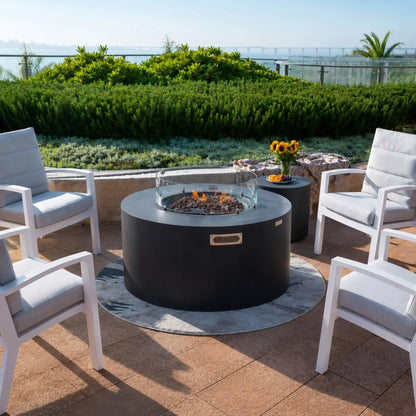 Elementi Art of Living weather-resistant fire pit cover designed for the Pacaya Dark Grey round hidden propane fire pit table. The durable dark protective cover fully encloses the circular GFRC concrete fire table, helping shield it from outdoor elements while preserving the finish and extending the lifespan of the luxury patio fire feature.