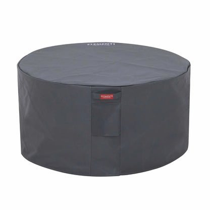 Three-quarter product view of the Elementi Art of Living Pacaya Dark Grey round fire pit table cover on a white background. The fitted protective cover is tailored for the Pacaya hidden propane fire pit table, offering full coverage of the circular GFRC concrete structure with durable weather-resistant material, clean lines, and an Elementi-branded front closure panel.