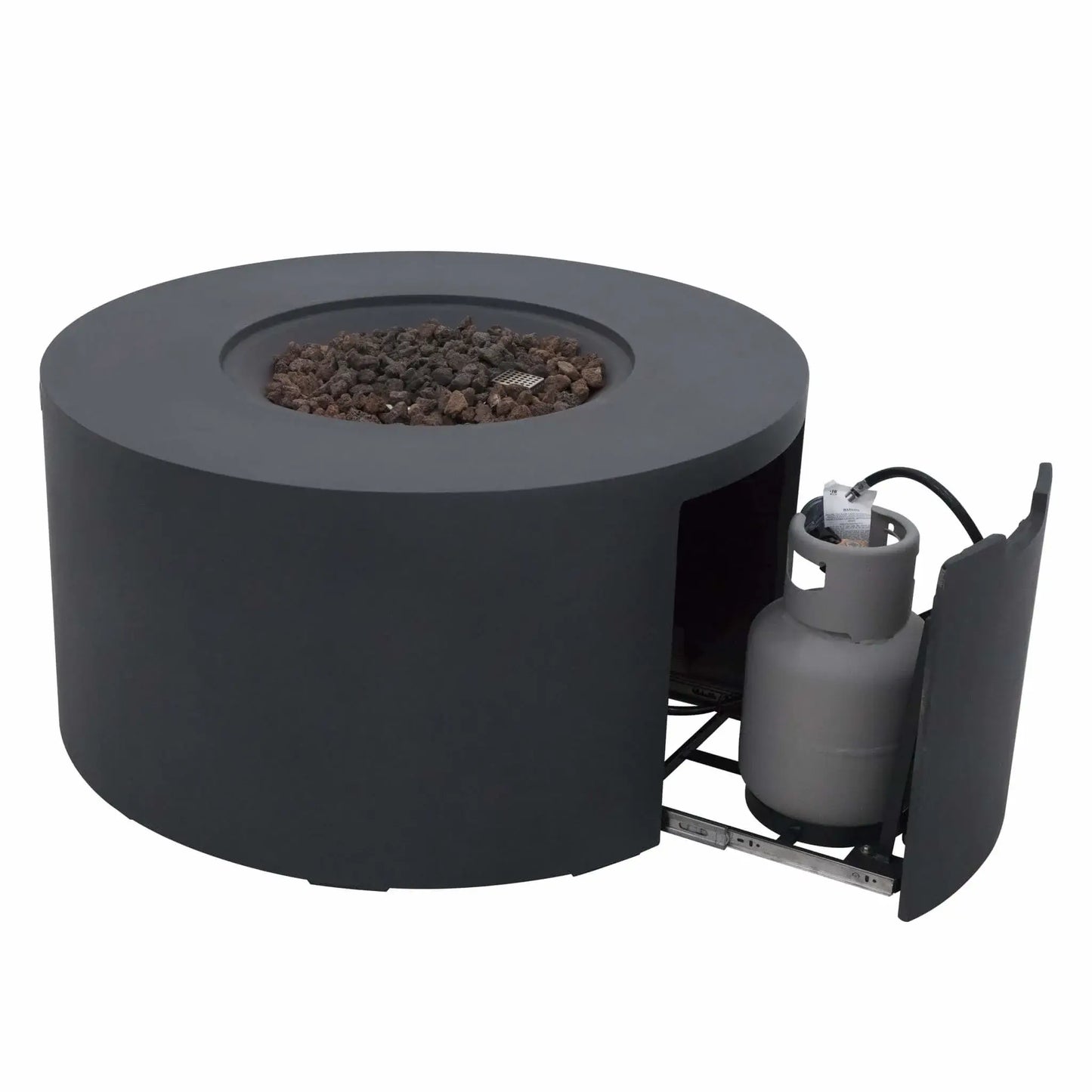 Front-angle product image of the Elementi Art of Living Pacaya Dark Grey round GFRC concrete fire pit table with the hidden propane storage drawer extended. The recessed lava rock burner area is visible without flames, demonstrating the concealed propane tank system, circular fire bowl design, and durable outdoor concrete construction against a white background.
