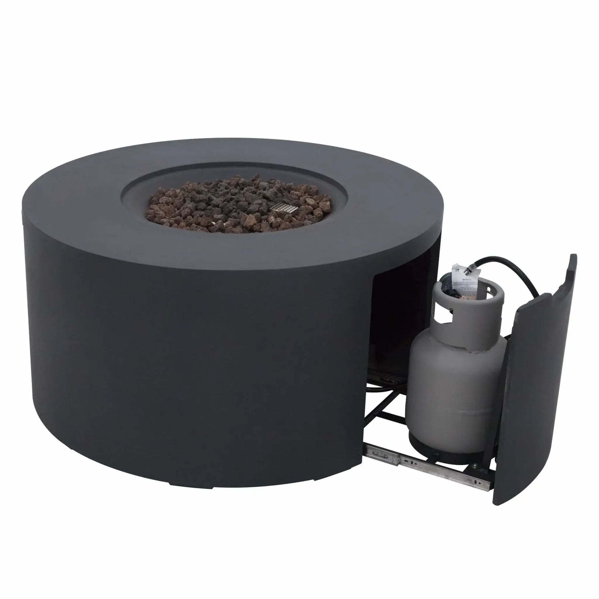 Front-angle product image of the Elementi Art of Living Pacaya Dark Grey round GFRC concrete fire pit table with the hidden propane storage drawer extended. The recessed lava rock burner area is visible without flames, demonstrating the concealed propane tank system, circular fire bowl design, and durable outdoor concrete construction against a white background.