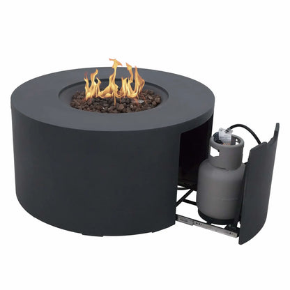 Elementi Art of Living Pacaya Dark Grey round GFRC concrete fire pit table shown with active flames burning over natural lava rock media and the hidden propane drawer extended. The image highlights the concealed propane tank storage system, sliding drawer mechanism, recessed burner area, and modern circular outdoor fire pit design against a clean white background.