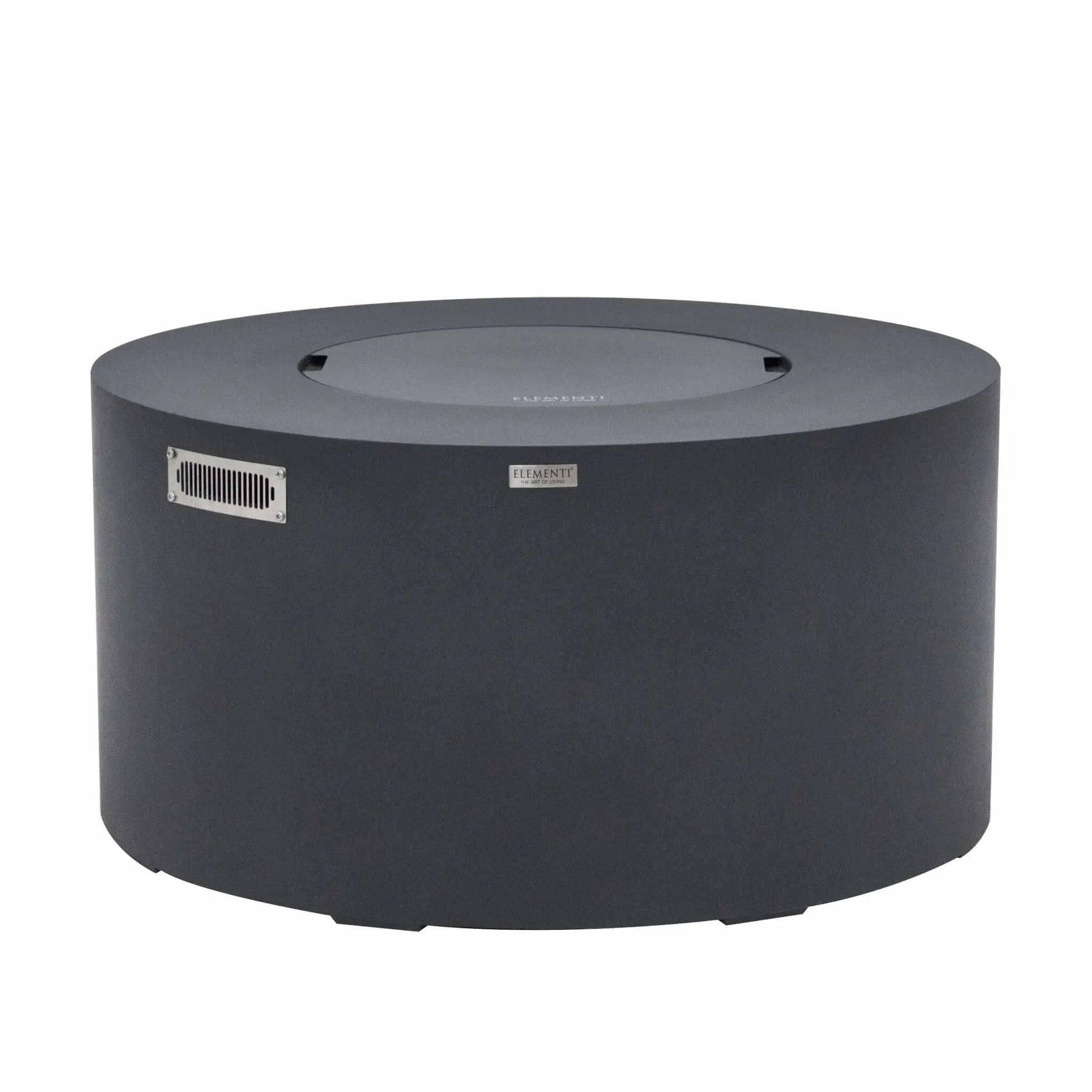 Front product view of the Elementi Art of Living Pacaya Dark Grey round GFRC concrete fire pit table with the burner area covered by its matching lid. This hidden propane fire pit table features a smooth cylindrical design, integrated ventilation panel, concealed propane storage system, and durable dark grey finish, displayed on a clean white background for product catalog and ecommerce presentation.