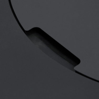 Close-up detail of the recessed handle cutout on the burner cover of the Elementi Art of Living Pacaya Dark Grey fire pit table. The image highlights the integrated lifting notch built into the round lid, emphasizing the concealed design and premium craftsmanship of the hidden propane GFRC concrete outdoor fire pit.