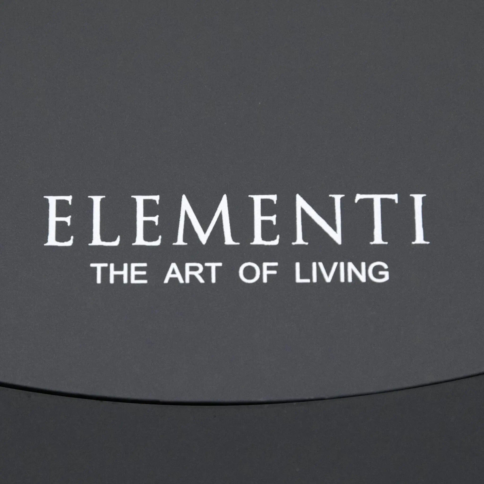 Close-up of the Elementi Art of Living branding printed on the removable burner cover of the Pacaya Dark Grey round fire pit table. The image showcases the clean finish of the GFRC concrete surface and reinforces the premium design details associated with this hidden propane outdoor fire feature.