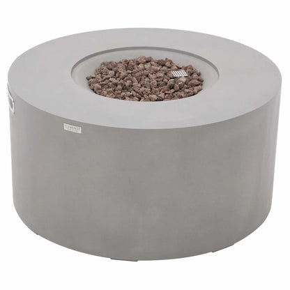 Angled product view of the Elementi Art of Living Pacaya Light Grey round fire pit table featuring a recessed burner area filled with natural lava rock media. The image showcases the smooth GFRC concrete body, circular fire bowl design, integrated ventilation system, and hidden propane configuration, making it an attractive centerpiece for contemporary outdoor living spaces.