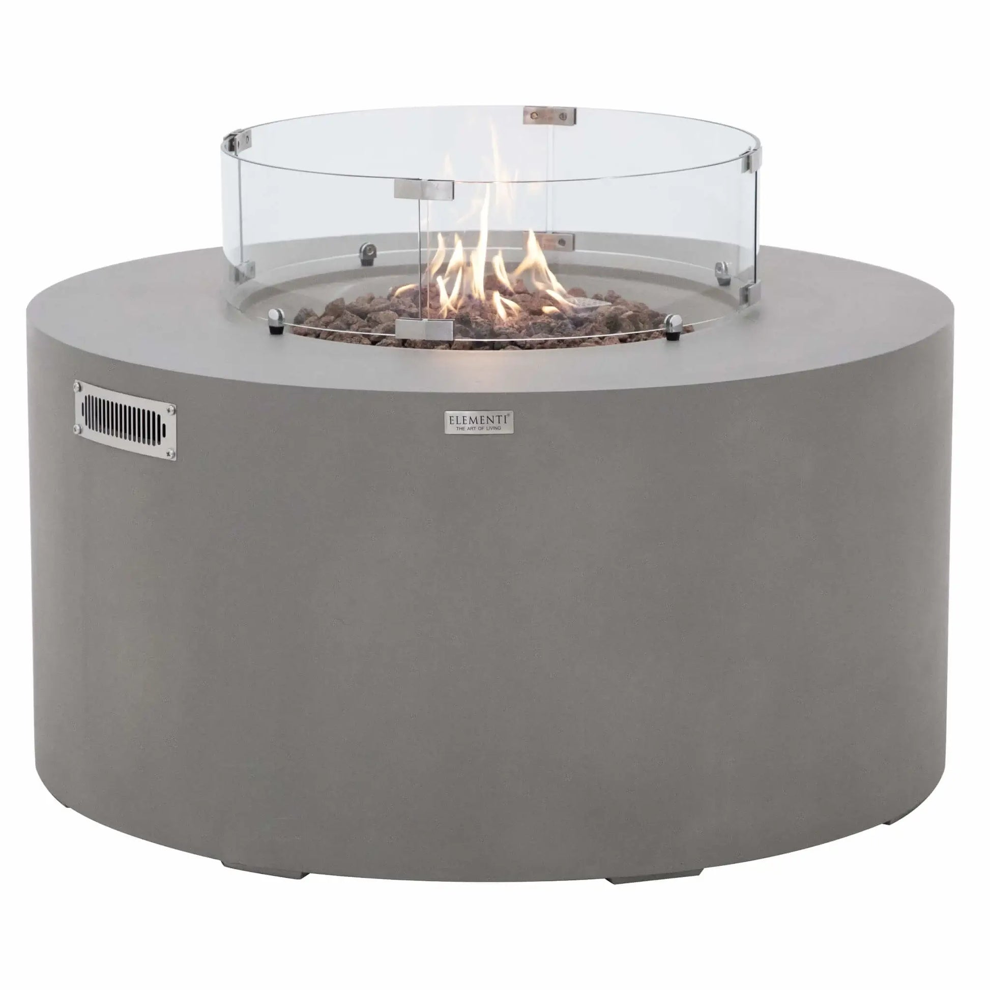 Front-facing product image of the Elementi Art of Living Pacaya Light Grey fire pit table with active flames burning above the lava rock media inside the tempered glass wind guard. The image highlights the round GFRC concrete construction, clean cylindrical profile, and warm flame display, illustrating the fire table in operation on a white background.