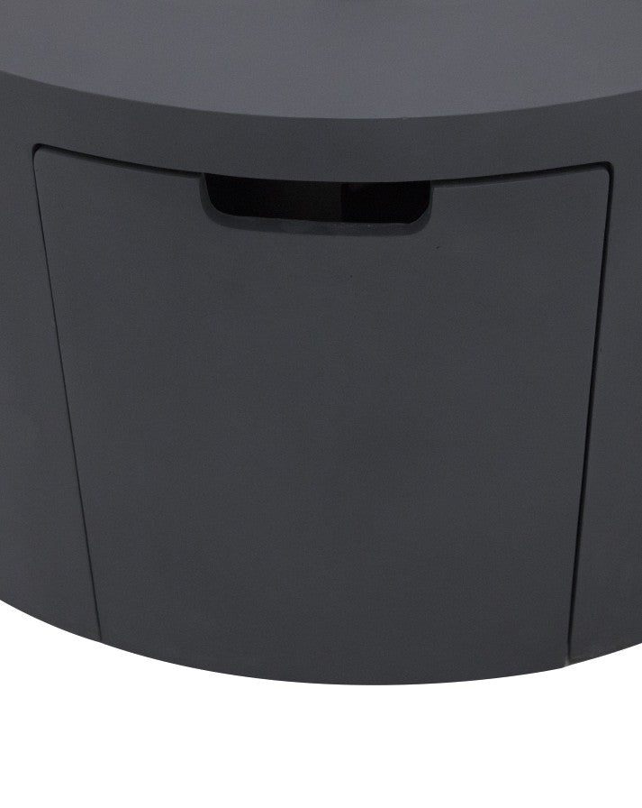 Close-up of the Elementi Pacaya Round Fire Pit Table’s hidden propane tank compartment, featuring a discreet pull-out drawer in dark grey GFRC concrete. Designed for seamless integration, this concealed access panel enhances both the functionality and sleek modern aesthetic of the fire pit, ensuring easy propane tank storage without compromising style.