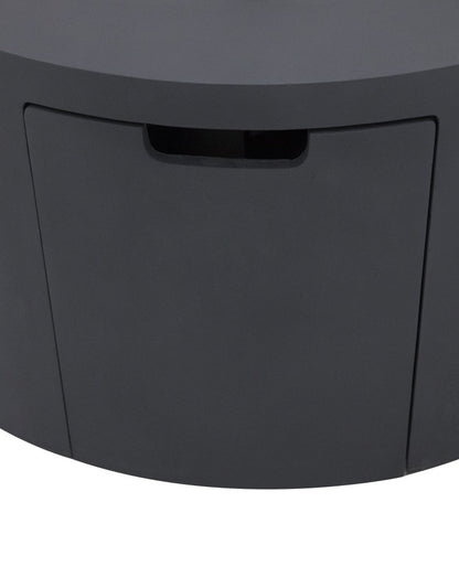 Close-up of the Elementi Pacaya Round Fire Pit Table’s hidden propane tank compartment, featuring a discreet pull-out drawer in dark grey GFRC concrete. Designed for seamless integration, this concealed access panel enhances both the functionality and sleek modern aesthetic of the fire pit, ensuring easy propane tank storage without compromising style.