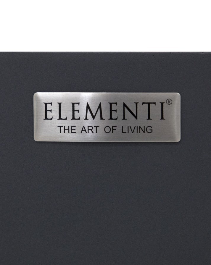 Close-up of the Elementi branding plaque on the Pacaya Round Fire Pit Table, featuring a sleek stainless steel nameplate with the inscription 'Elementi – The Art of Living.' Mounted on the dark grey GFRC concrete surface, this emblem represents the brand’s commitment to luxury outdoor design, craftsmanship, and modern fire pit innovation.