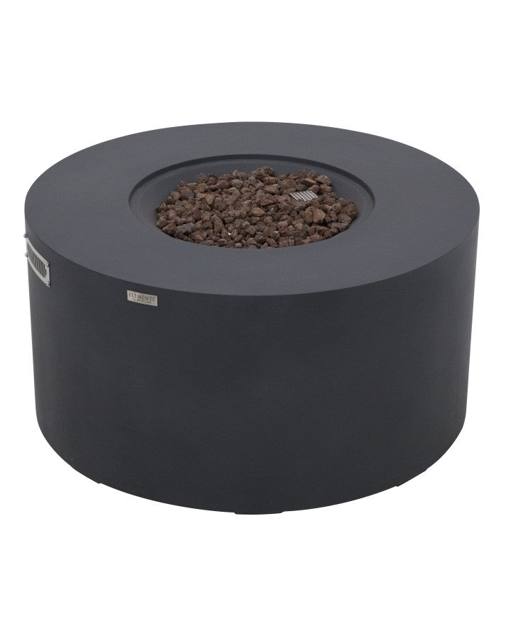 Elementi Pacaya Round Fire Pit Table in dark grey GFRC concrete, featuring a recessed burner filled with natural lava rocks for enhanced heat distribution and a modern aesthetic. Designed with a hidden propane tank, sleek ventilation panels, and a minimalist silhouette, this luxury fire pit seamlessly blends style and functionality for elegant outdoor living spaces.