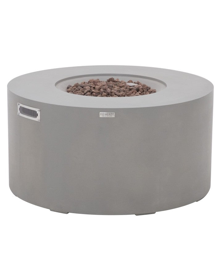Elementi Pacaya Round Hidden Propane Tank Fire Pit Table in light grey GFRC concrete, featuring a sleek, modern design with natural lava rocks for enhanced ambiance. This durable fire pit combines style and function, creating a cozy outdoor gathering space.