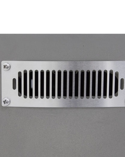 Close-up of the Elementi Pacaya Round Hidden Propane Tank Fire Pit Table’s stainless steel side vent, seamlessly integrated into the light grey GFRC concrete structure. This ventilation system ensures optimal airflow and safety while maintaining the fire pit’s sleek, modern design.