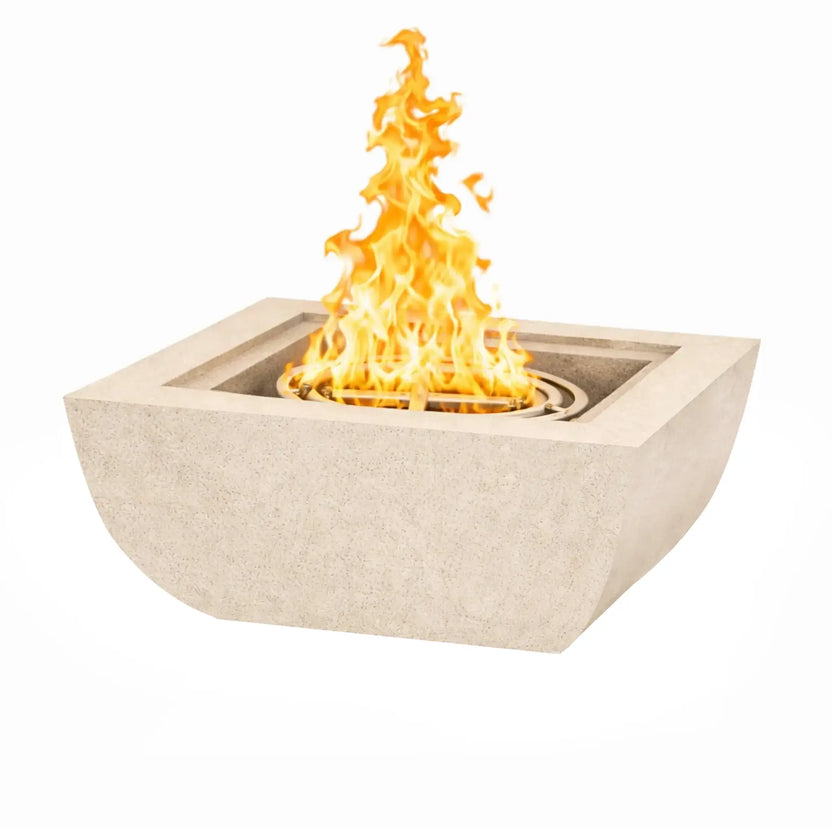Clean product shot of a Serenity Series square curved fire bowl in a soft white finish. The modern fire bowl features a recessed burner system with bright flames rising above the center ring. Smooth rounded edges and a minimalist concrete design make it ideal for contemporary poolside or patio fire feature installations.