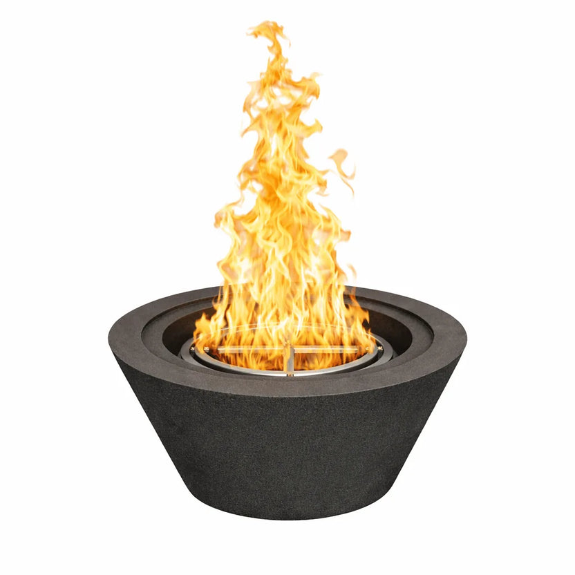 Flame Havens 30 inch round cone fire bowl in a black GFRC concrete finish, shown with a tall natural gas flame rising from the stainless steel burner, highlighting the bold tapered design for upscale outdoor living spaces.