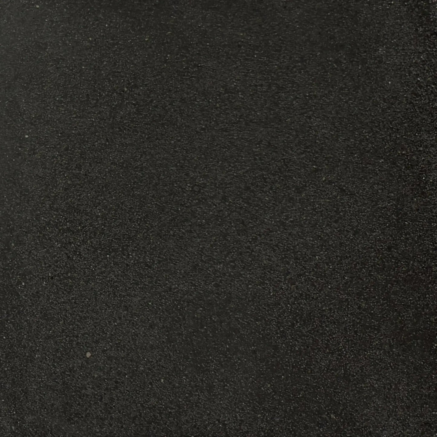 Full-size black GFRC concrete finish sample by Flame Havens, highlighting the rich dark tone and subtle aggregate texture characteristic of durable glass fiber reinforced concrete fire features.