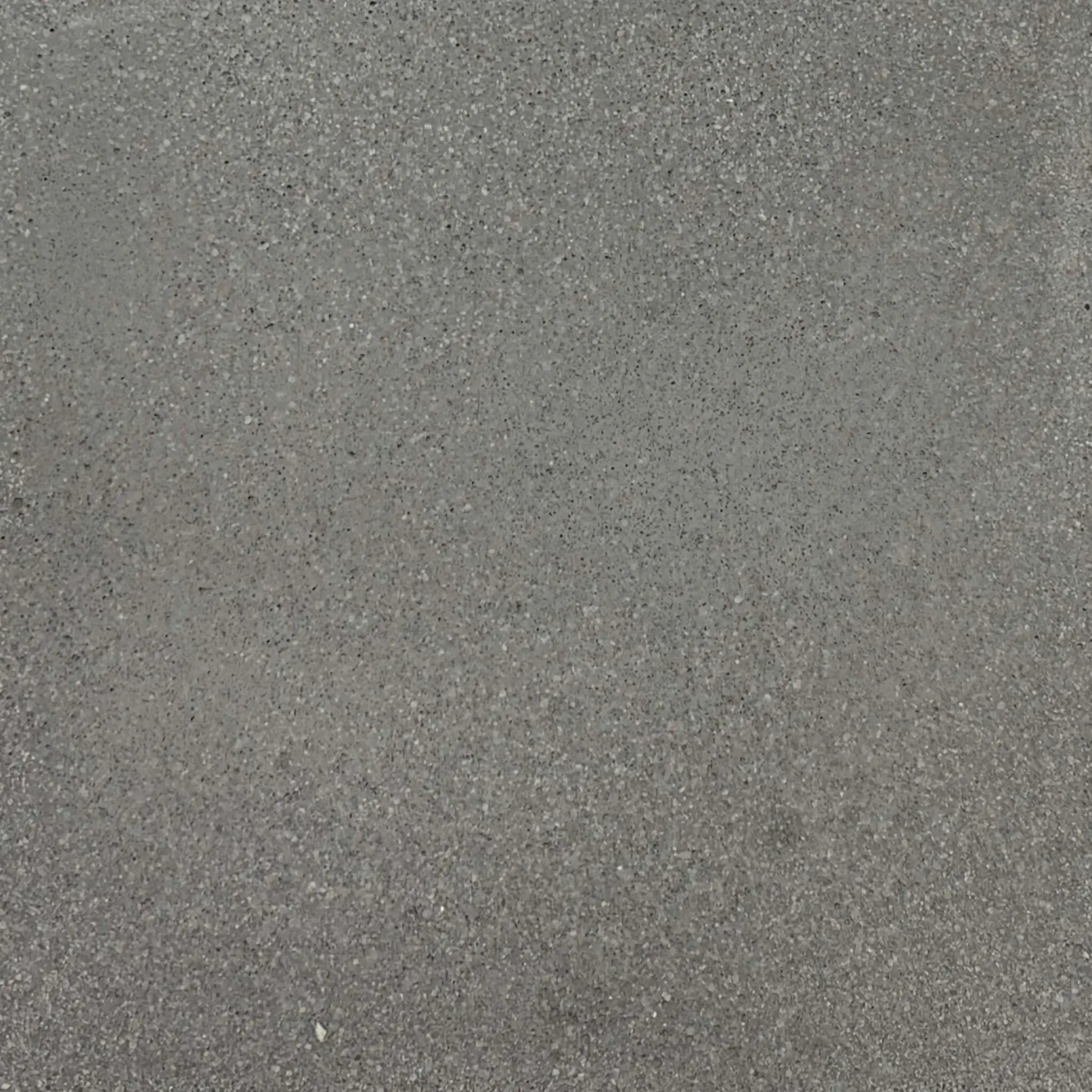 Gray glass fiber reinforced concrete finish sample by Flame Havens, showing natural tonal variation and fine aggregate detail ideal for modern outdoor fire bowls and architectural installations.