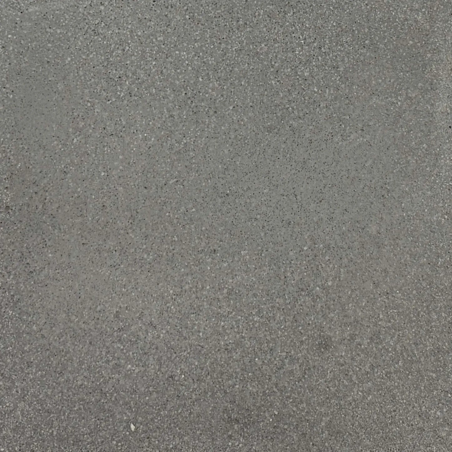Gray glass fiber reinforced concrete finish sample by Flame Havens, showing natural tonal variation and fine aggregate detail ideal for modern outdoor fire bowls and architectural installations.