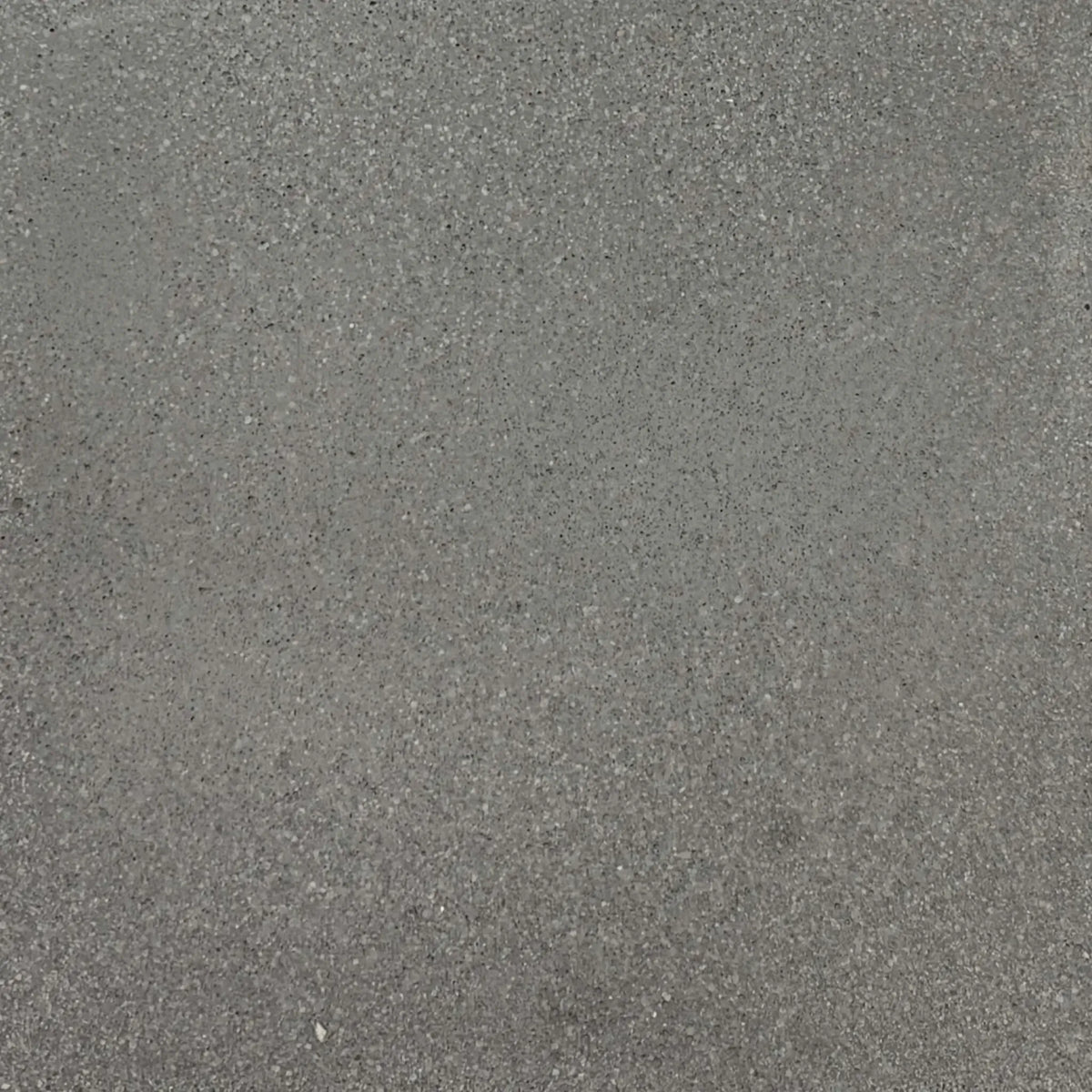 Gray glass fiber reinforced concrete finish sample by Flame Havens, showing natural tonal variation and fine aggregate detail ideal for modern outdoor fire bowls and architectural installations.