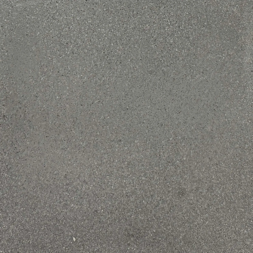Gray glass fiber reinforced concrete finish sample by Flame Havens, showing natural tonal variation and fine aggregate detail ideal for modern outdoor fire bowls and architectural installations.