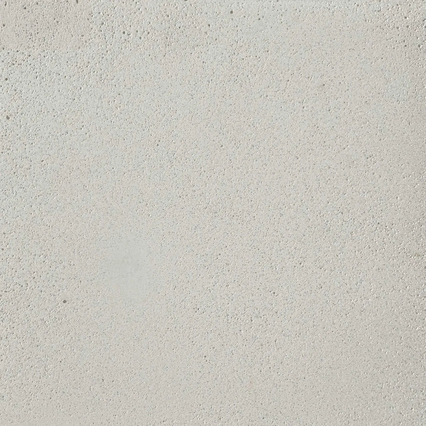 Close-up view of Flame Havens Concrete GFRC Glass Fiber Reinforced Concrete Swatch White V4 finish featuring a clean ivory-white concrete texture with subtle pores, fine aggregate detail, and a smooth matte surface. The GFRC finish is designed for contemporary outdoor fire pits, modern patio fire tables, and durable all-weather concrete fire feature installations.