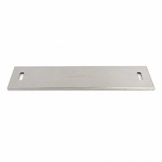 Flame Havens Refuge Series 33 x 11-inch rectangular stainless steel burner cover shown in full against a white background. The brushed metal cover features a slim, low-profile design, rounded rectangular handle openings at both ends, finished edges, and a centered caution message indicating the surface may be hot after use.