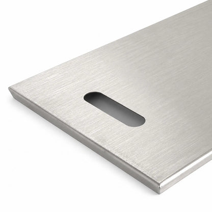 Close-up of the left handle on the Flame Havens Refuge Series 45 x 11-inch rectangular stainless steel burner cover. The rounded rectangular hand opening is cut into the brushed metal surface near the end, while the folded perimeter edge adds a clean, finished profile.