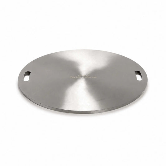 Angled product view of the Flame Havens Refuge Series 24-inch round stainless steel burner cover on a white background. The circular cover has a brushed finish, two recessed carrying handles positioned on opposite sides, a low-profile finished edge, and a centered warning that it may be hot after use.