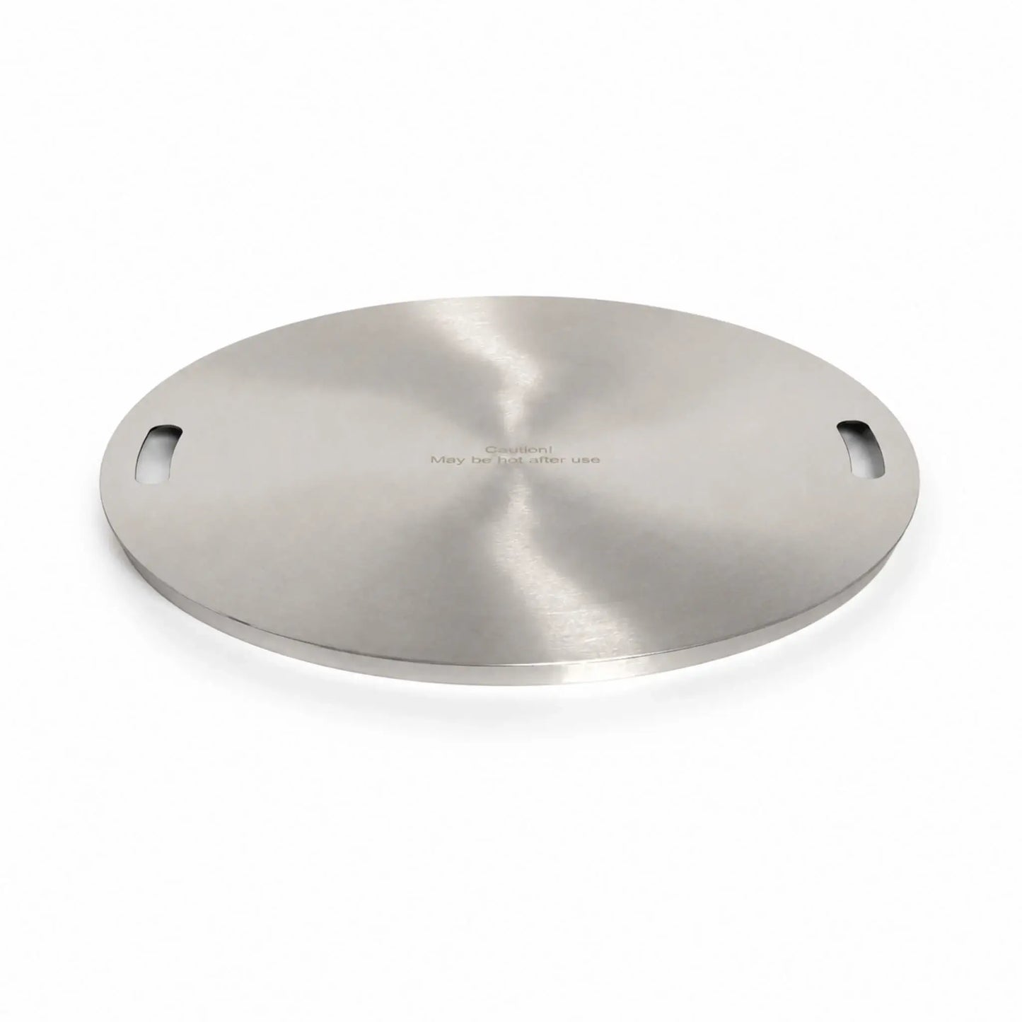 Main view of the Flame Havens Refuge Series 24-inch round stainless steel burner cover. Shown at a low angle on a white background, the circular accessory features a reflective brushed finish, two integrated handle openings, a slim raised edge, and the engraved message, “Caution! May be hot after use.”