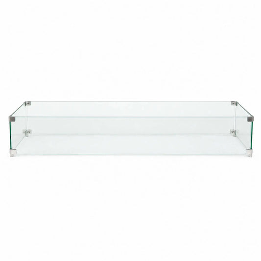 Full front view of the Flame Havens Refuge Series 48 x 14 x 7-inch rectangular tempered glass wind guard shield on a white background. Four clear glass panels form a long protective enclosure, joined by brushed stainless steel corner brackets and supported by compact metal feet at each corner.