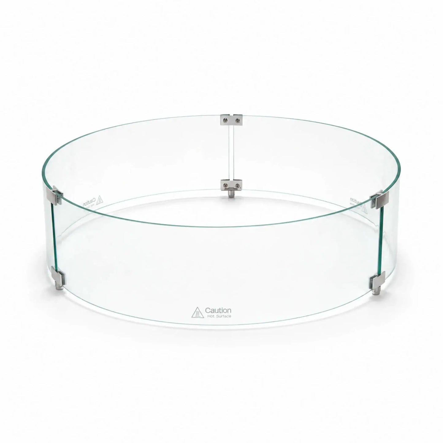 Angled main view of the assembled Flame Havens Refuge Series tempered glass wind guard shield, measuring 28 inches in diameter by 7 inches tall. Three curved clear glass panels form a complete circle, joined by silver clamps and raised support feet, with “Caution Hot Surface” warnings near the bottom.