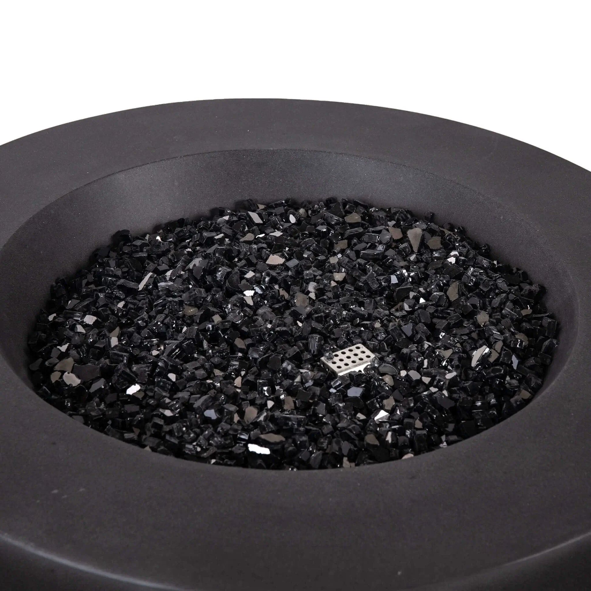 Close-up view of the Flame Havens Refuge Series 36-inch Round Natural Gas GFRC Concrete Fire Pit in Black, showcasing the premium black reflective fire glass evenly covering the stainless steel burner system. The image highlights the smooth concrete finish, generous burner opening, and elegant round design, demonstrating the upscale appearance of the Black Fire Glass media before the fire pit is ignited.