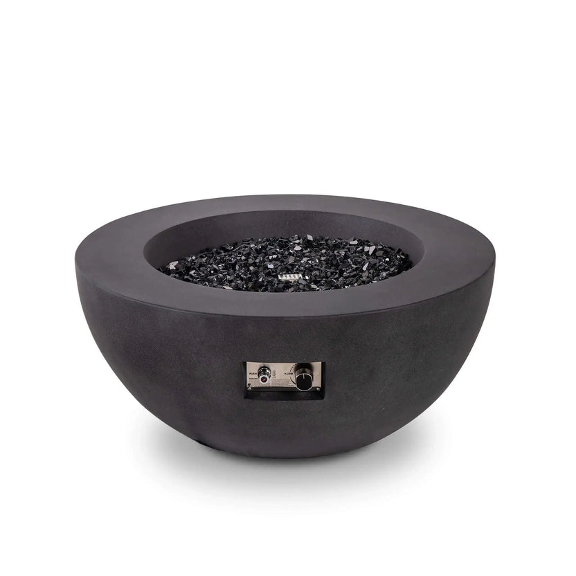 Front view of the Flame Havens Refuge Series 36-inch Round Natural Gas GFRC Concrete Fire Pit in Black with premium tempered black reflective fire glass installed and the burner turned off. The recessed stainless steel CSA ignition controls remain visible, highlighting the clean appearance, premium materials, and modern design before ignition.