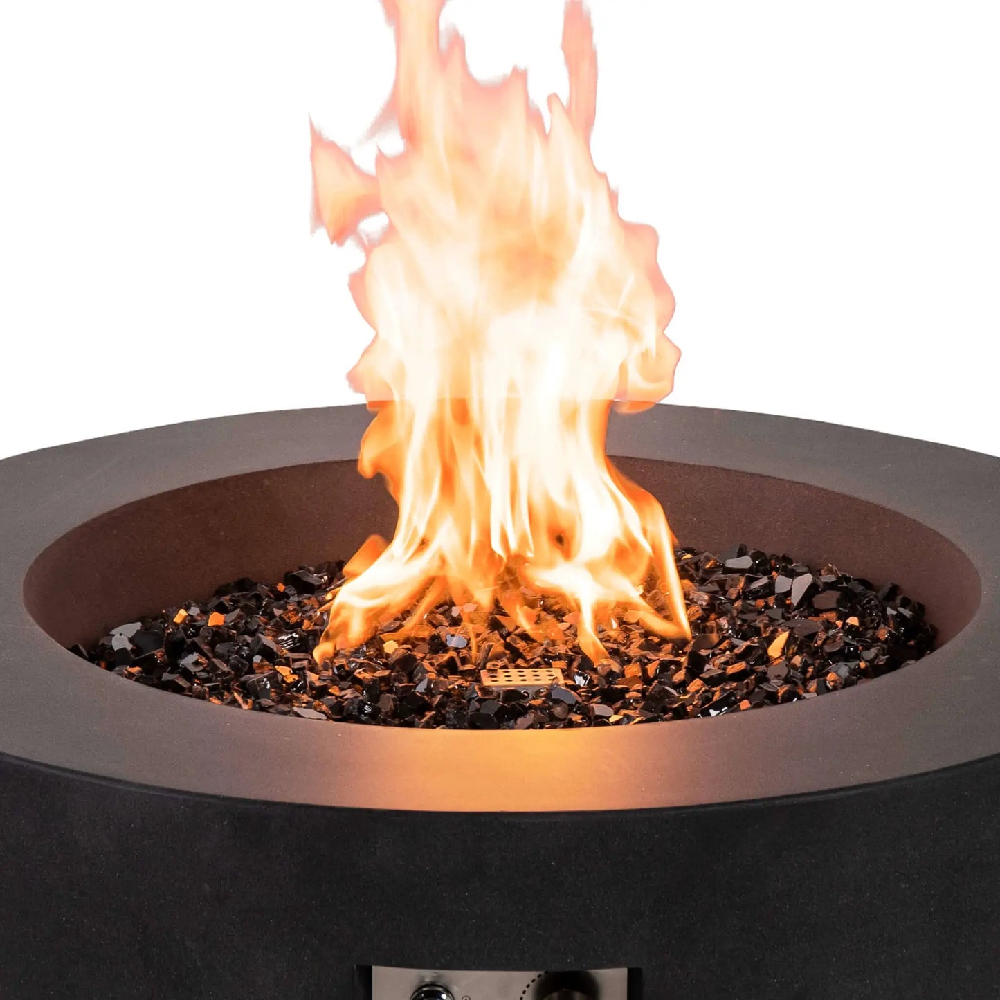Close-up of the Flame Havens Refuge Series 36-inch Round Natural Gas GFRC Concrete Fire Pit in Black with bright natural gas flames dancing above premium tempered black reflective fire glass. The image captures the rich texture of the GFRC concrete, reflective fire media, and powerful flame display while the front ignition controls remain partially visible below.