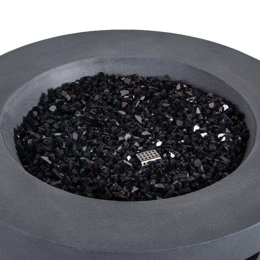 Top-down product view of the Flame Havens Refuge Series 36-inch Round Natural Gas GFRC Concrete Fire Pit in Gray filled with premium black reflective fire glass. The image highlights the generous burner area, reflective tempered fire media, and concealed CSA ignition system beneath the glass, showcasing the clean, contemporary design of this luxury outdoor fire pit.