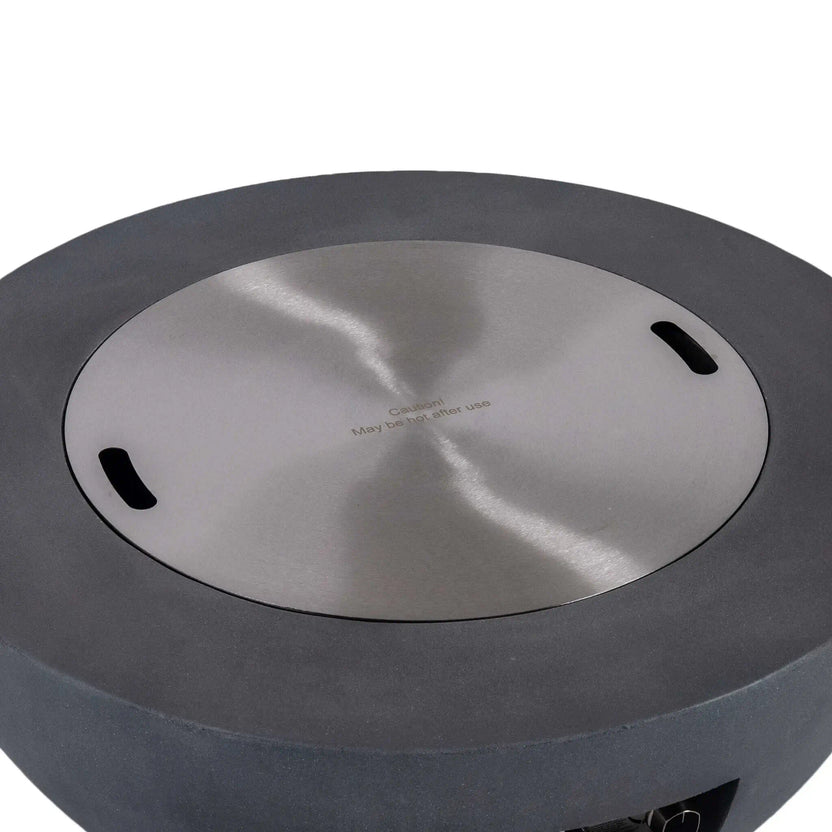 Top product view of the Flame Havens Refuge Series 36-inch Round Natural Gas Gray GFRC Concrete Fire Pit with the brushed stainless steel burner cover installed. The flush-fitting cover features integrated hand openings and a clean satin finish, converting the fire feature into a stylish outdoor coffee table when the burner is not in operation.