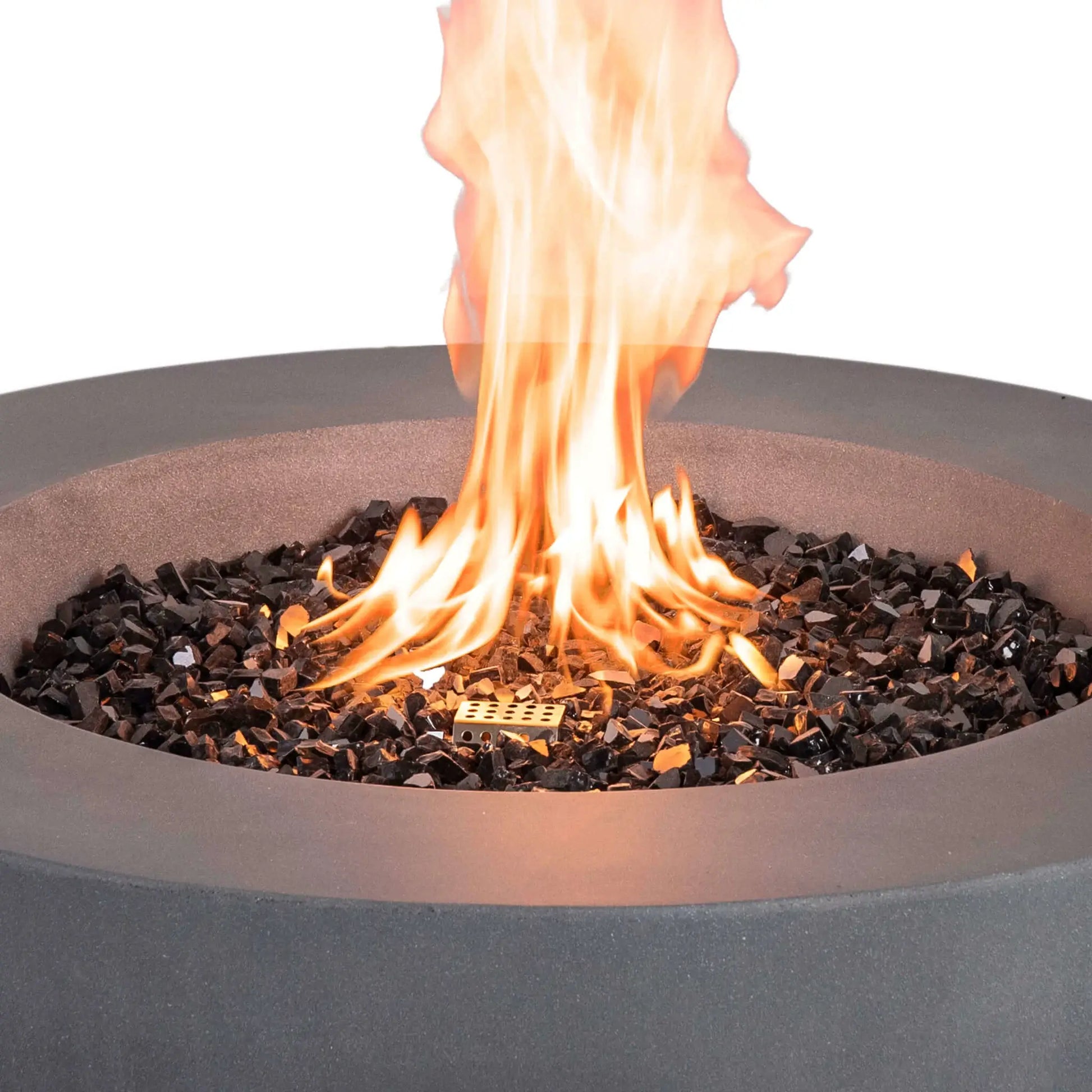 Detailed close-up of the Flame Havens Refuge Series 36-inch Round Natural Gas GFRC Concrete Fire Pit in Gray with black tempered reflective fire glass surrounding the stainless steel burner. Bright flames rise from the burner while the textured gray GFRC concrete rim frames the fire, highlighting the premium materials and realistic flame presentation.