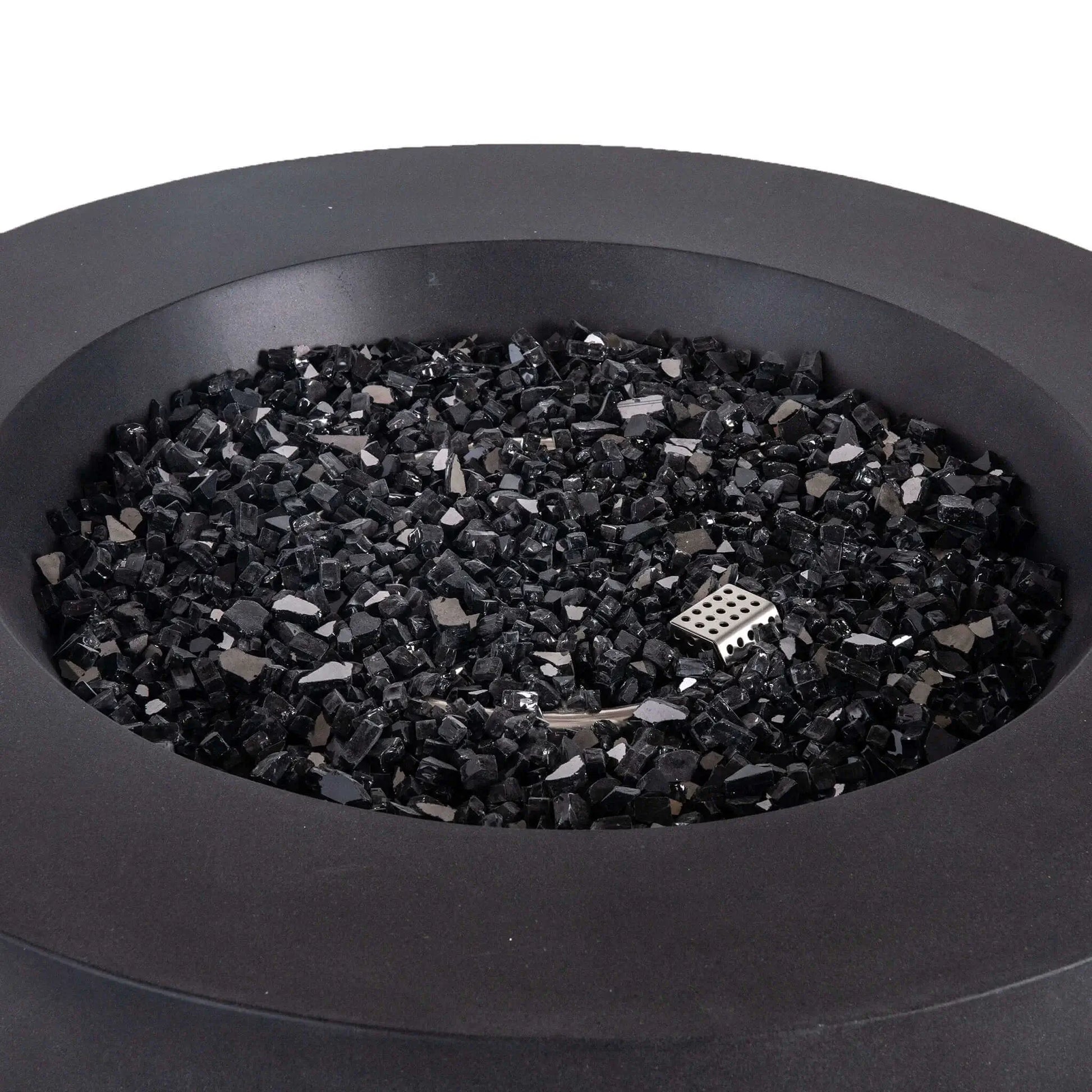 Close-up view of the Flame Havens Refuge Series 36-inch Round Propane Gas GFRC Concrete Fire Pit in Black, showcasing premium 1/2-inch Black Reflective Fire Glass evenly covering the stainless steel burner pan. The image highlights the smooth Graphite Black GFRC concrete finish, concealed CSA ignition, and luxurious media designed to create a modern outdoor centerpiece for patios and backyard living spaces.