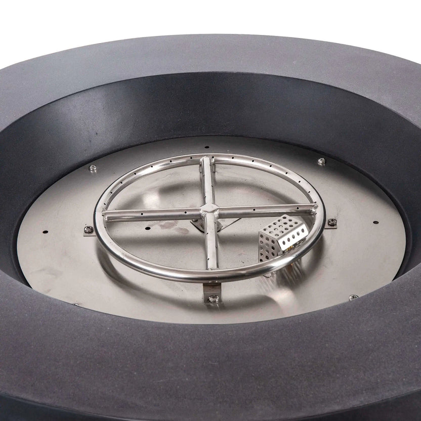 Close-up of the Flame Havens Refuge Series 36-inch Round Propane Gas GFRC Concrete Fire Pit with Black Reflective Fire Glass removed to reveal the stainless steel burner ring, burner pan, and CSA-certified ignition system. The image highlights the premium stainless steel construction engineered for reliable propane gas performance and long-lasting outdoor durability.