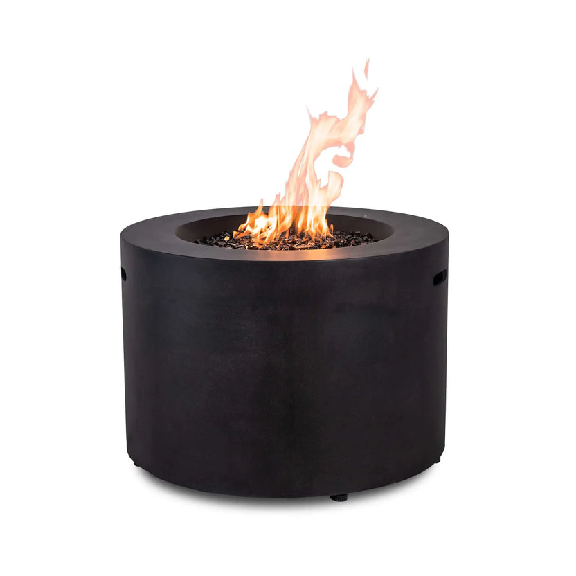 Rear view of the Flame Havens Refuge Series 36-inch Round Propane Gas GFRC Concrete Fire Pit operating with vibrant flames rising above premium Black Reflective Fire Glass. The image highlights the smooth Graphite Black GFRC concrete exterior and clean cylindrical profile without visible controls, making it ideal for luxury outdoor living spaces.