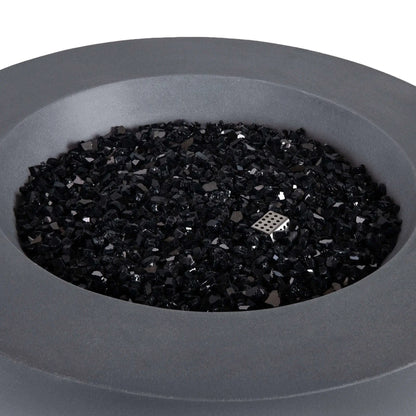 Close-up of the Flame Havens Refuge Series 36-inch Round Propane Gas GFRC Concrete Fire Pit in Natural Gray featuring premium Black Reflective Fire Glass with the burner off. The image showcases the smooth GFRC concrete finish, generous burner basin, and stainless steel ignitor housing concealed beneath the decorative fire glass for a refined contemporary appearance.