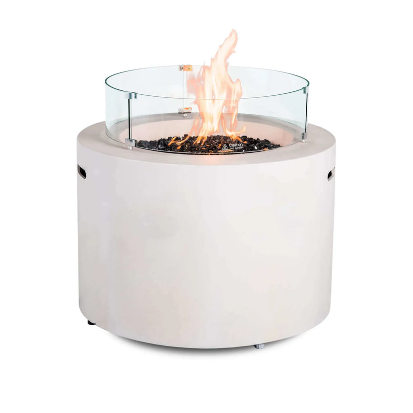 Front product image of the Flame Havens Refuge Series 36-inch Round Propane Gas GFRC Concrete Fire Pit in Ivory White operating with premium Black Reflective Fire Glass and the optional tempered glass wind guard installed. The stainless steel burner produces a tall natural flame while the clear wind guard enhances flame protection without obstructing the modern round fire pit's elegant design.
