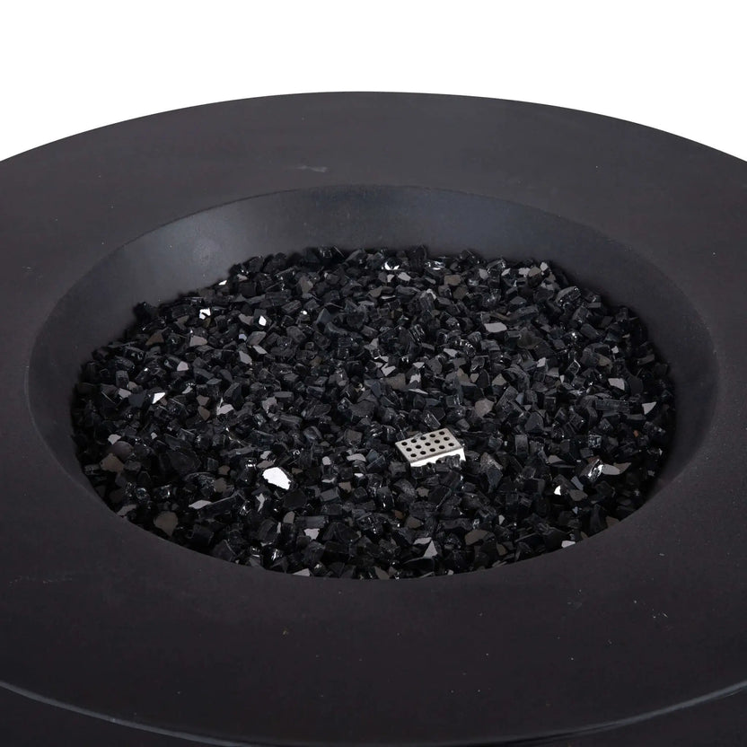 Top-down view of the Flame Havens Refuge Series 43-inch Round Natural Gas GFRC Concrete Fire Pit in Black, showcasing the premium black concrete finish filled with reflective black fire glass. A stainless steel CSA-certified ignition component is subtly visible among the fire glass, highlighting the clean burner design and modern aesthetic for luxury outdoor living spaces.